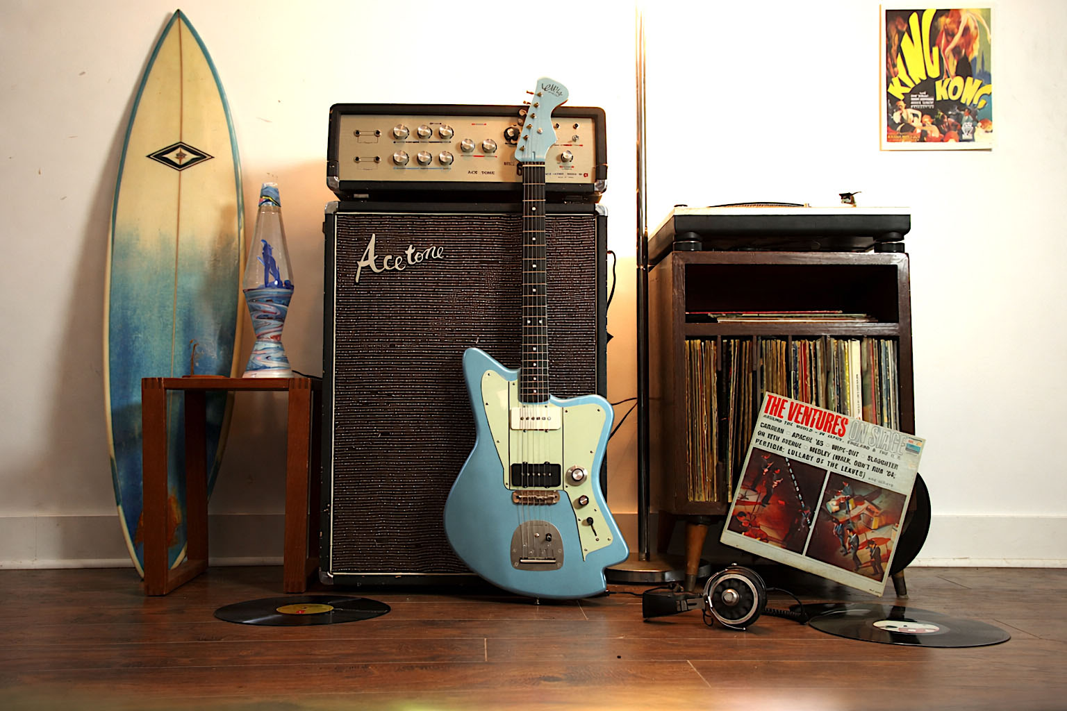 Lewis guitar with vintage amplifier and surfboard